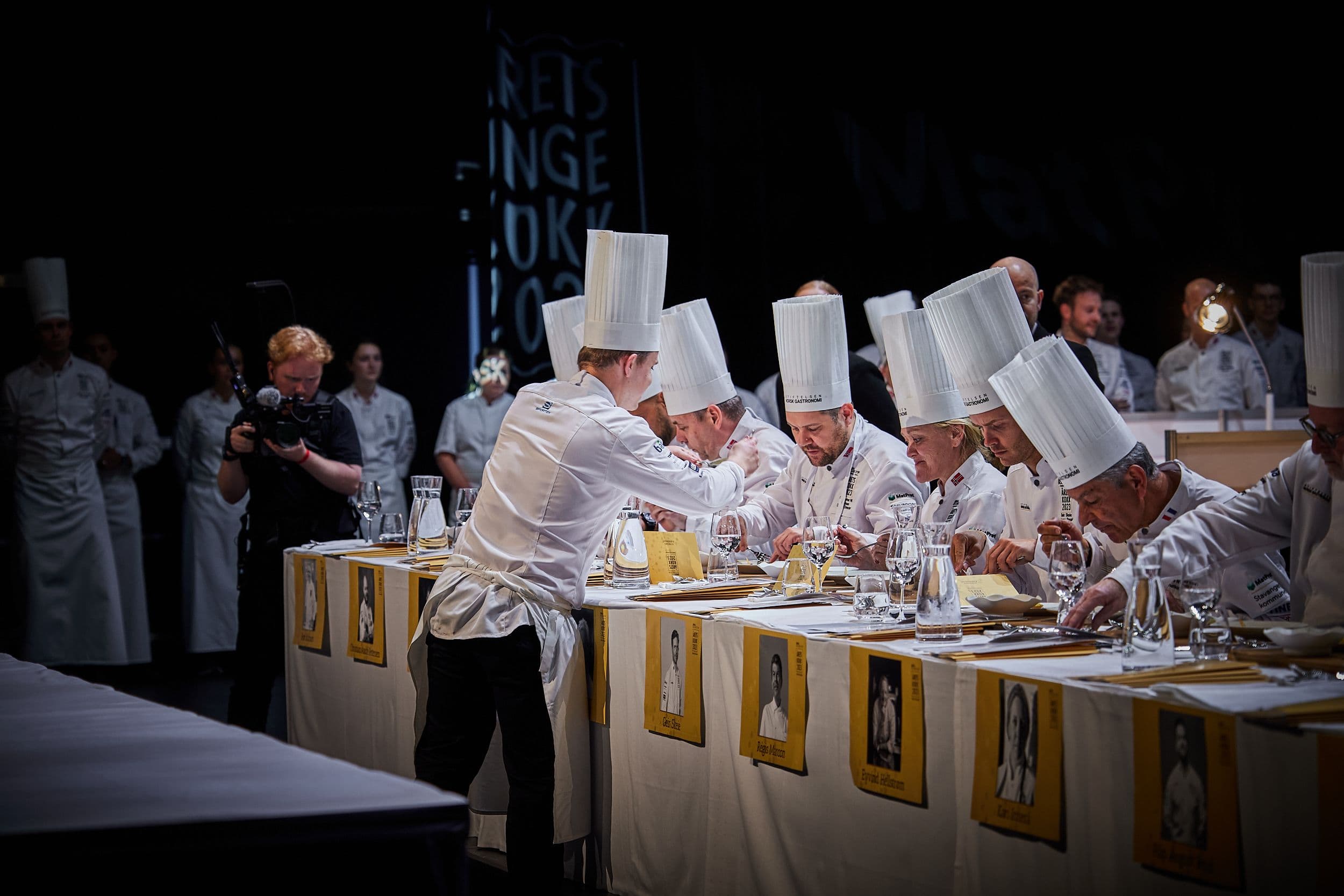 Chef garnishing a competition plate